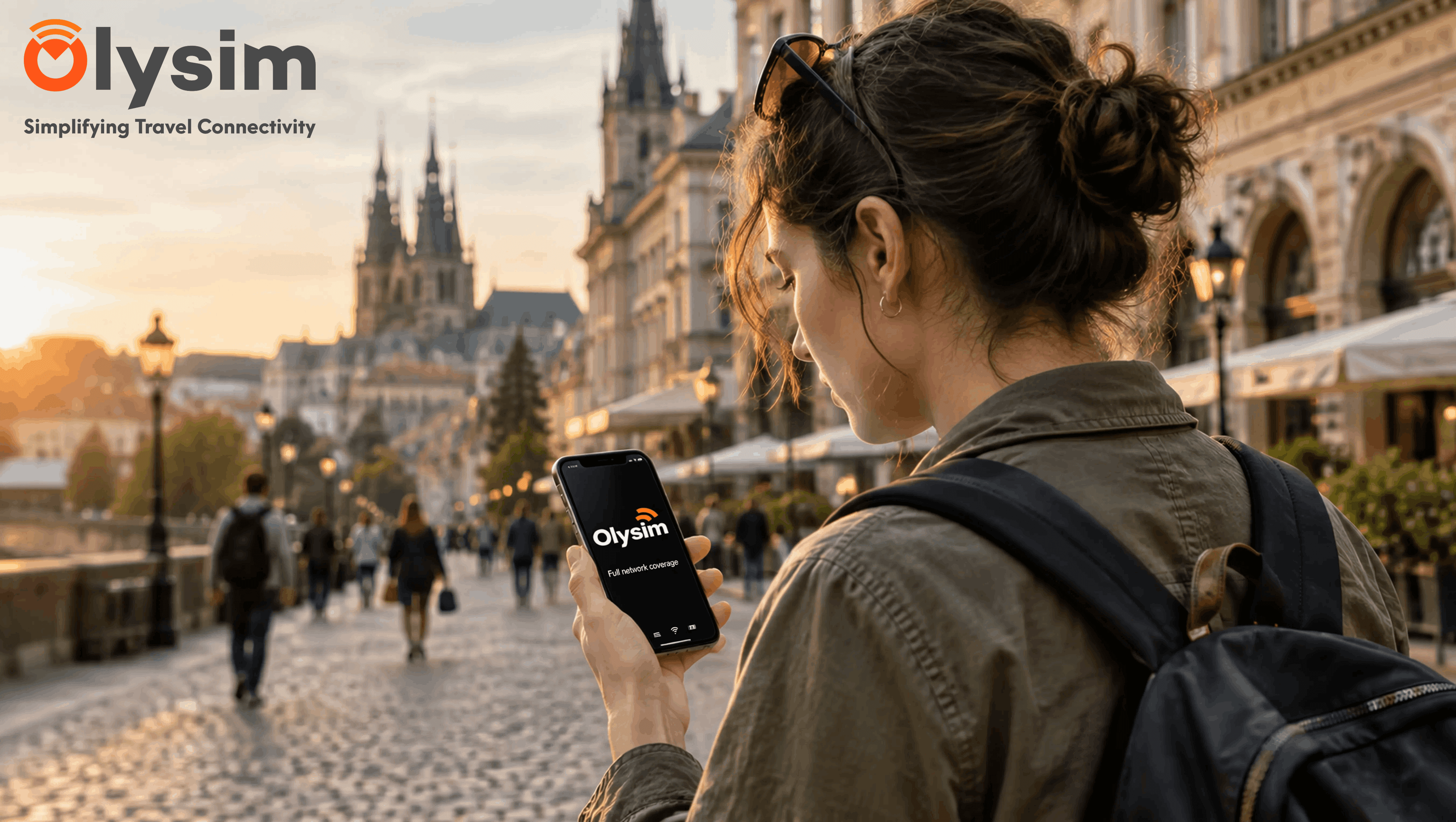 Close-up of a travellers phone screen showing a dropped signal icon while walking through a city street